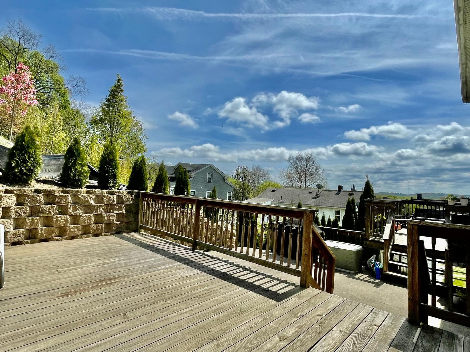 Spacious outdoor deck with scenic neighborhood views